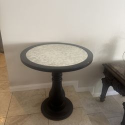 Wooden Round Table With One Stand . The Color Is Black.