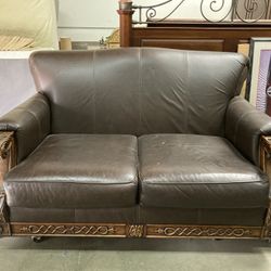 Brown leather Couch With Carved Wooden Feet And Arms