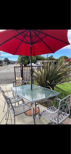 4-Piece Glass Top Patio Dining Set with Red Umbrella
