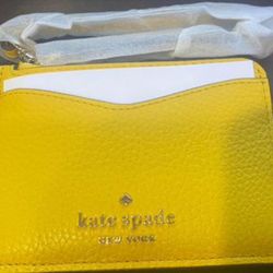 Brand new! Small Kate spade wristlet coin and card wallet. Retail $89
