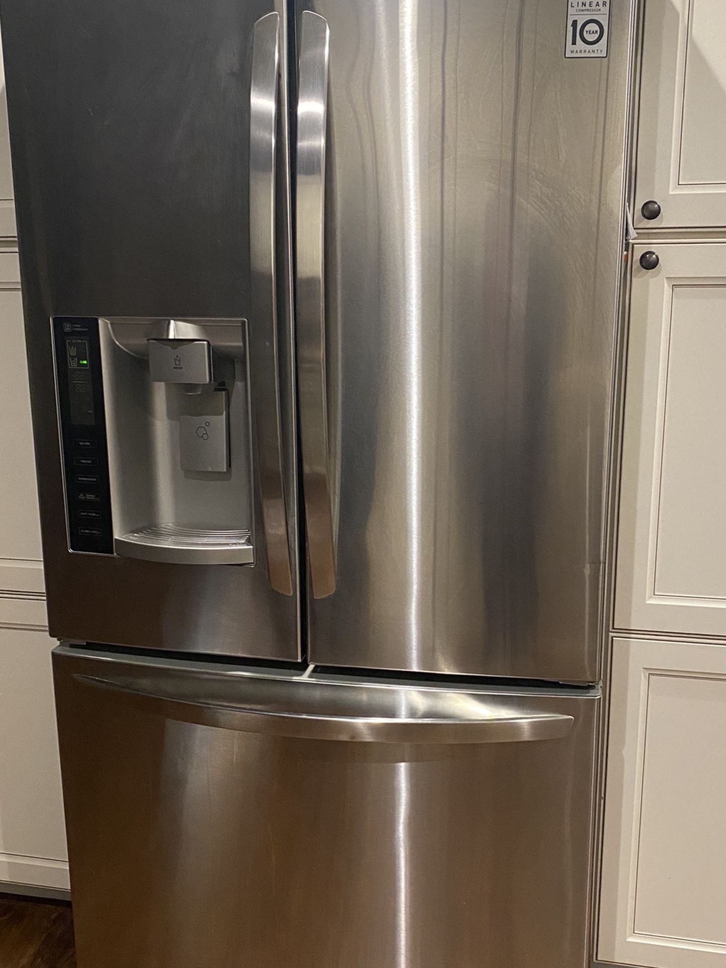Stainless Steel Appliances: Whirlpool Refrigerator, Stovetop, & General Electric Dishwasher