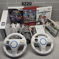 NINTENDO WII with Mario Kart,Mario Bros.Mario Galaxy,WII Sports