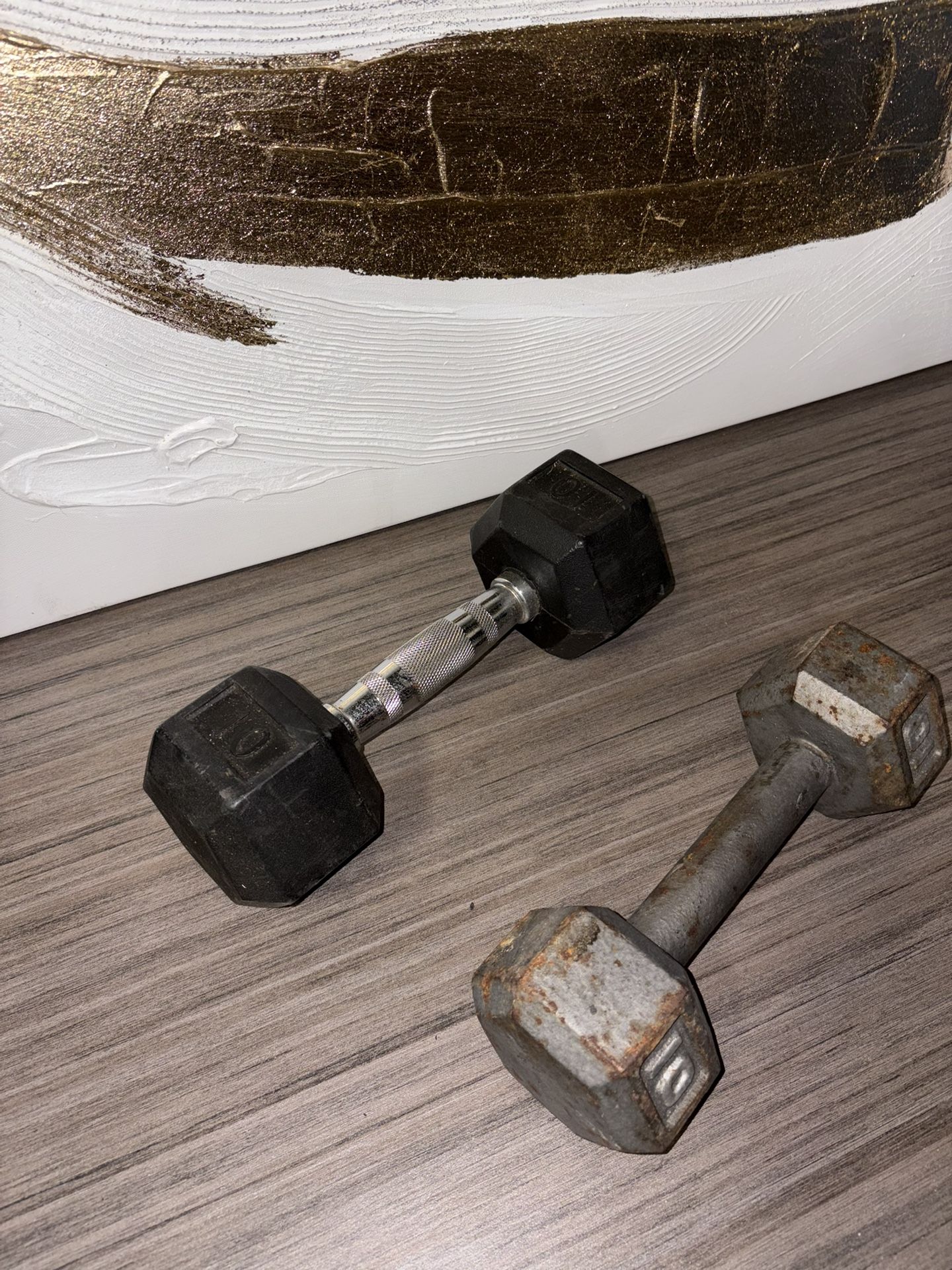 Set of two 10-pound dumbbells, perfect for strength training, home workouts, or fitness routines. Solid construction with comfortable grip and durable