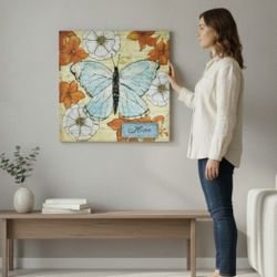 16" X 16" Butterfly and Floral Home Rustic/Farmhouse Style Canvas Print Wall Art. The butterfly and flowers Print has the word "Home" written on a sma