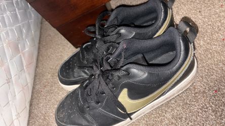 Black Ang gold Nikes