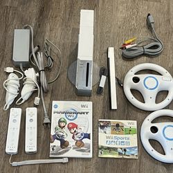 NINTENDO WII + MARIO KART and WII SPORTS GAMES