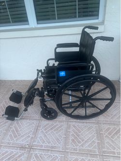 Wheel chair with adjustable feet rests wheelchair