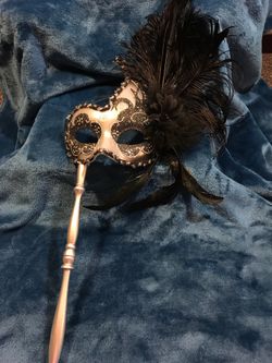 Venetian mask on stick
