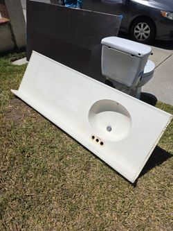 Vanity top, mirror and toilet