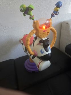 Fisher price bounce and sin zebra ride on toy- works