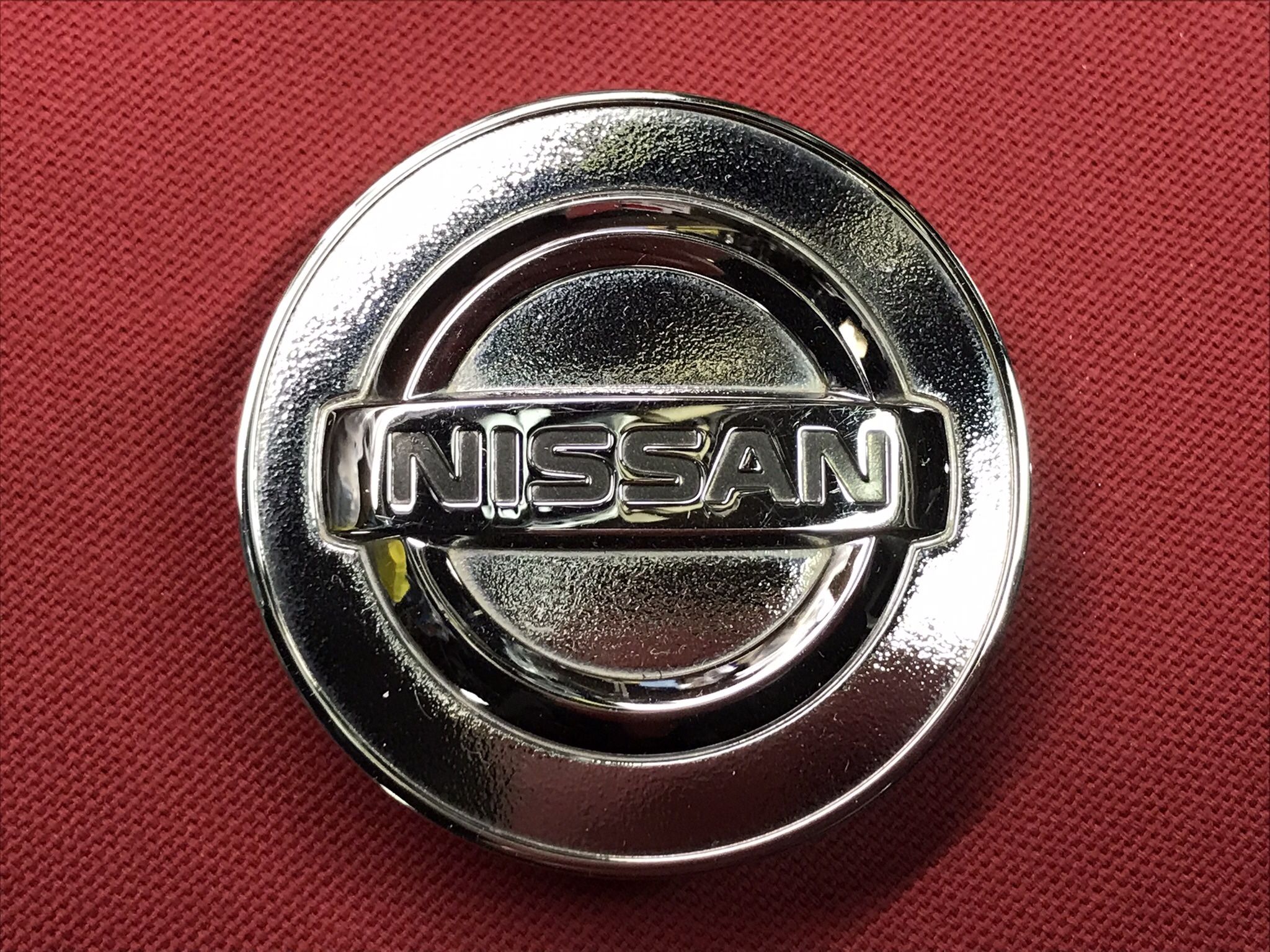 Nissan Metallic Rim Center Cap.