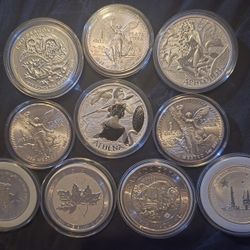 6 Coins 1 Ounce.. 1 Coin 2 Ounces.. 2 Half Ounce Coins.. 1 1/4  Ounce Coin Total Of 10 Ounces And A Quarter Of Silver.