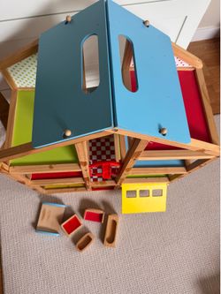 Melissa & Doug Hi-Rise Wooden uuDollhouse.
