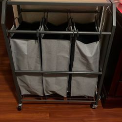 New laundry hamper with three bags. I don't have space where I planned to put it.