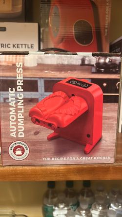 Automatic dumpling press