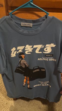 This Aelfric Eden blue graphic t-shirt features a vintage streetwear design with a Japanese graphic print on the front. L