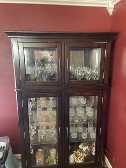 Dark Wooded lighted cabinet