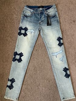 Amiri Light Wash Denim Jeans with Patches