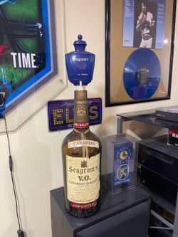 Very large glass old  Seagrams bottle