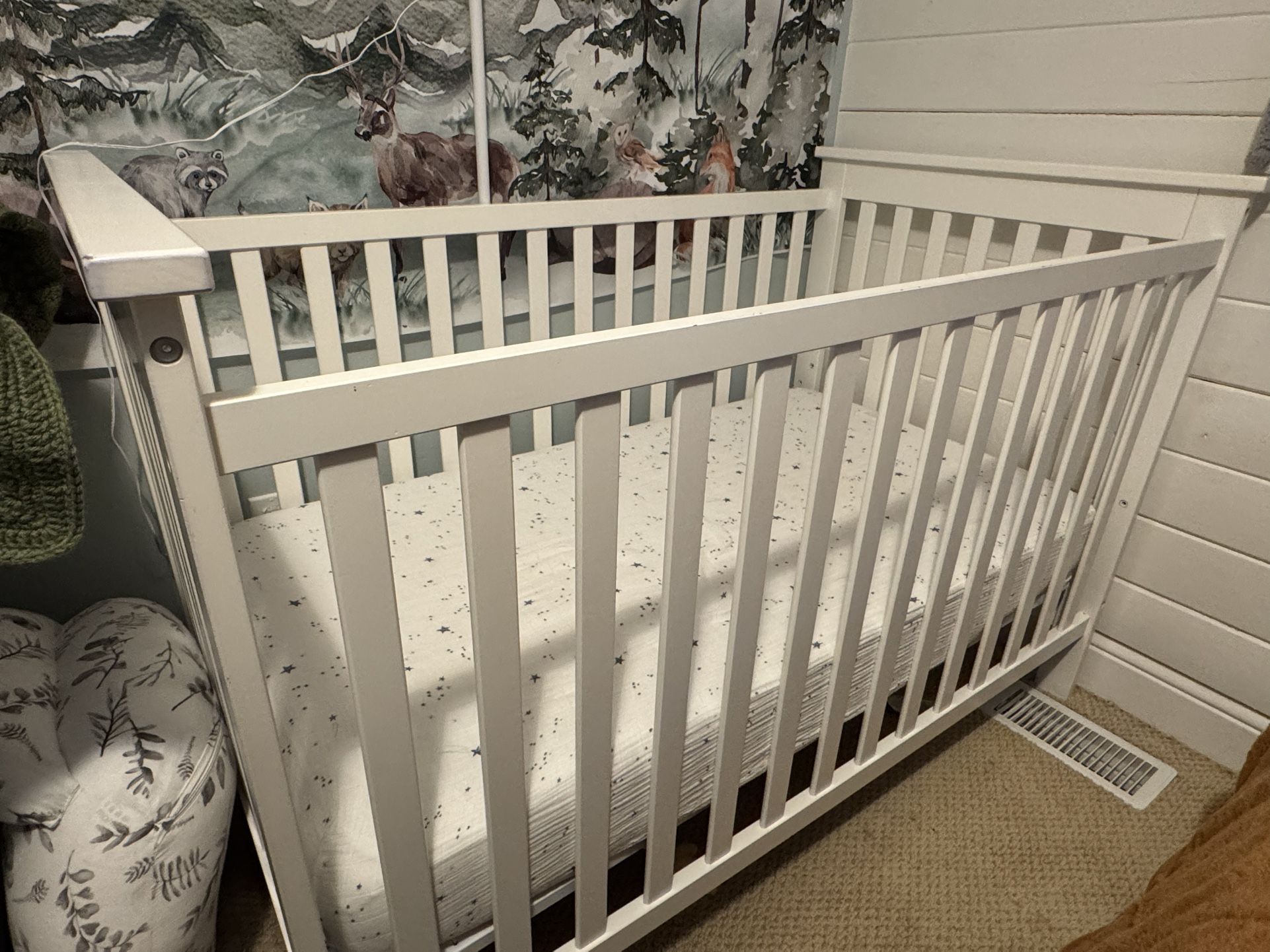 White wood baby crib with mattress