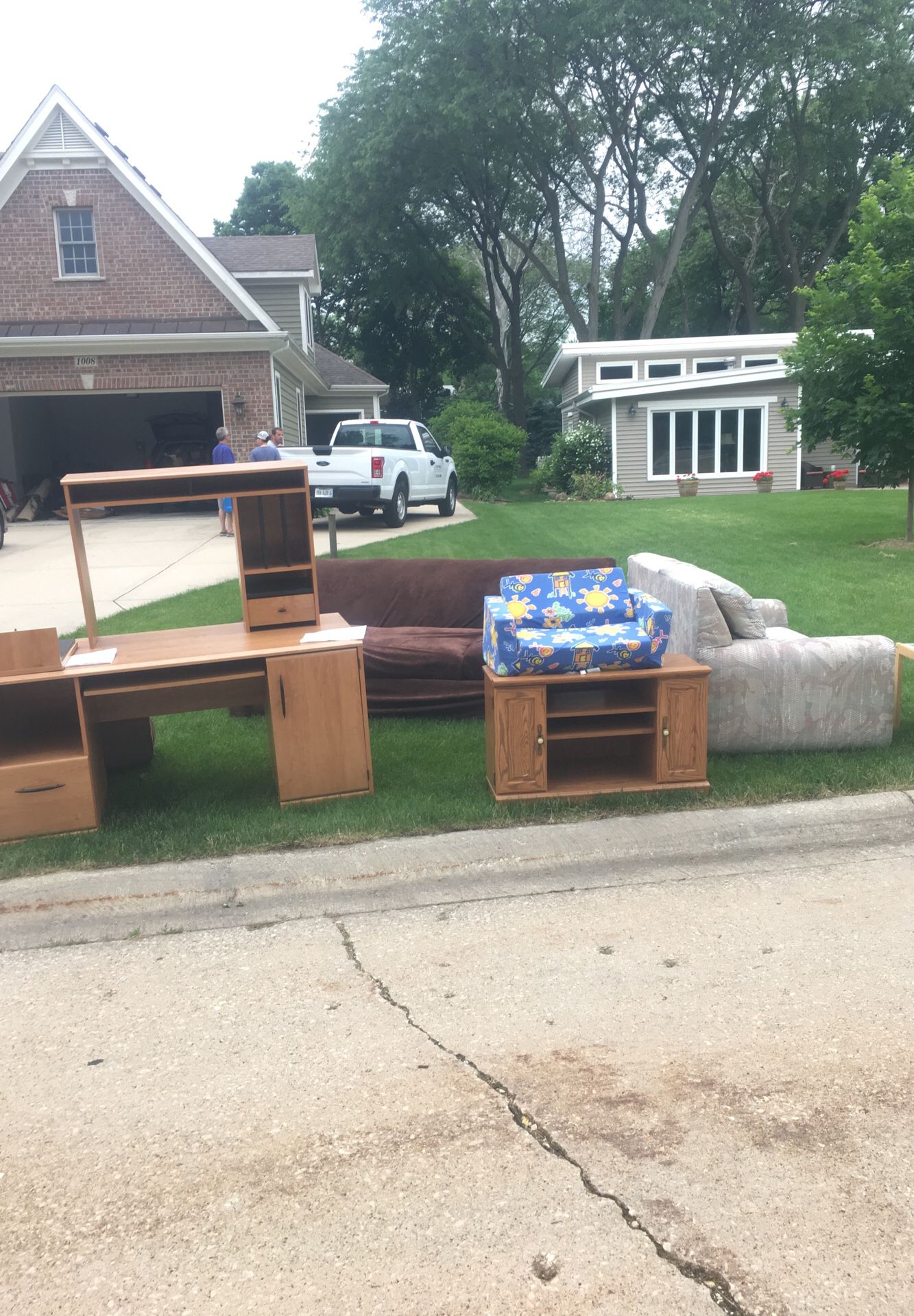 Miscellaneous items free at curb. Desk, couches tv stand