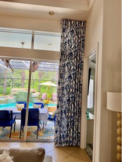 Blue Patterned Curtains lined side panels height 141 1/2 wide 80 inch like new.