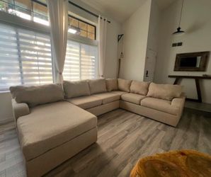 Large Beige U-Shaped Sectional Sofa