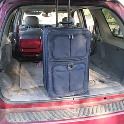 NICE AMERICAN TOURISTER PULL ALONG LUGGAGE