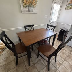 Brown solid wood dining table set with four chairs
