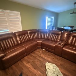 Leather brown sectional sofa two end recliners