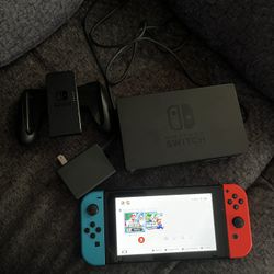 Nintendo Switch with Neon Blue & Neon Red Joy-Con (32GB) Bundle with MightySkins Voucher – Customizable Gaming Console 