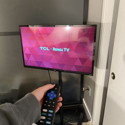 32 Inch Roku TV on removable mounting stand 