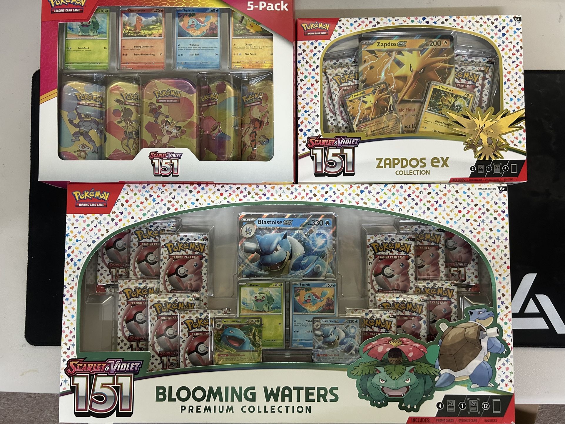 151 Pokemon Bundle 26 packs: 151 Blooming waters, 151 Costco Mini Tins, 151 Zapdos Ex Box