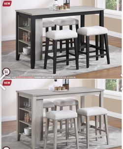 Dinner table set with chairs