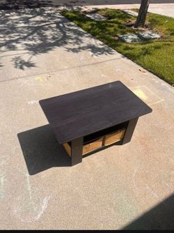Coffee table with pull out drawers