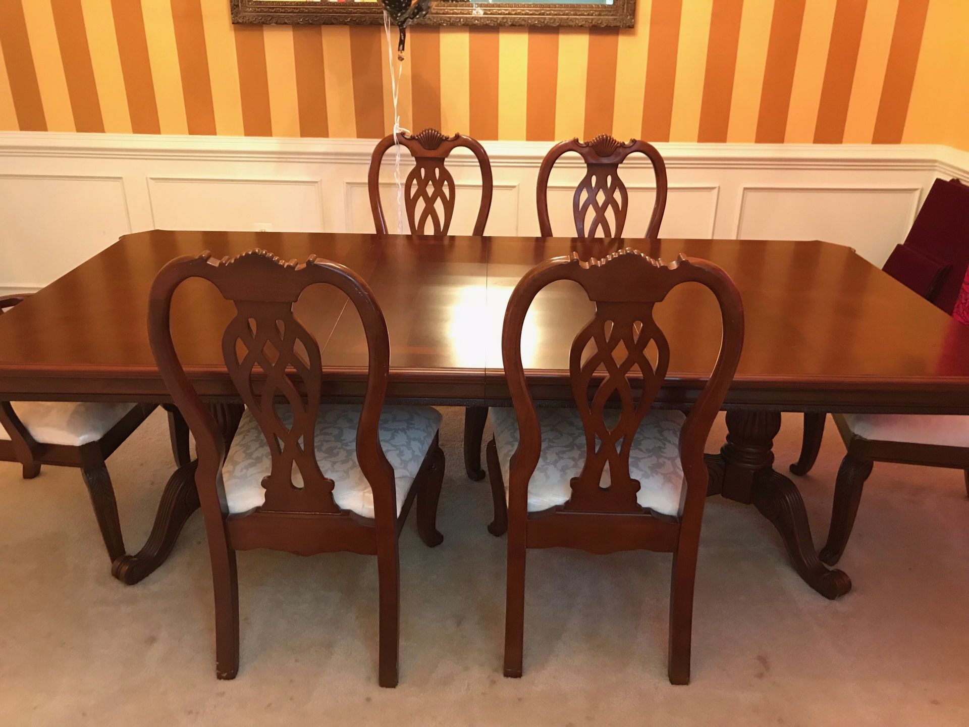 Real wood- mahogany wood- heavy dining table set for 6 chairs included. Extendable table to seat 8