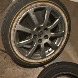One Cadillac Rim And Tire. 