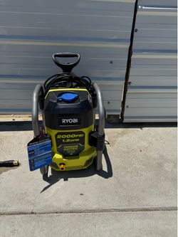 2000 psi Ryobi electric pressure washer includes gun, hose, water tips