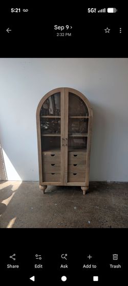 Tall arch mango wood cabinet with glass doors