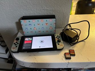 Nintendo switch regular 2 games + charger + dock