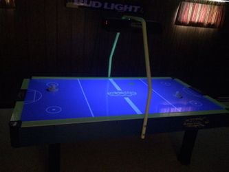 Blacklit air hockey table