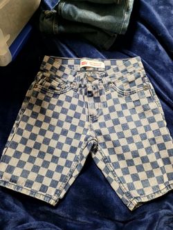 Levi's 502 Regular Taper Shorts for boys, featuring a distinctive blue and white checkerboard printed denim design.While exact new stock for this spec