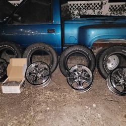 Chevy Truck Rim And Tire And Edlebrock Carburetor 