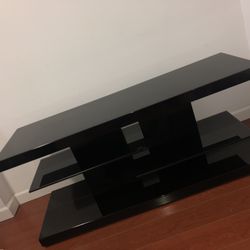 TV/books Stand - Perfect Condition. Middle Section is of glass, Long: 48” inches // wide: 16.5”. $130