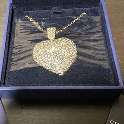 Brand new gold puffed  Swarovski crystal heart necklace.