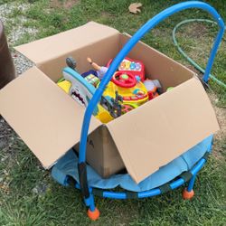 Box Of Toys And Trampoline 