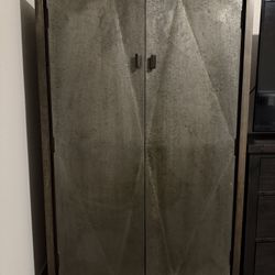 LIVING SPACES 2 DOOR STORAGE CABINET (METAL COVERED DOORS / WOOD FRAME)