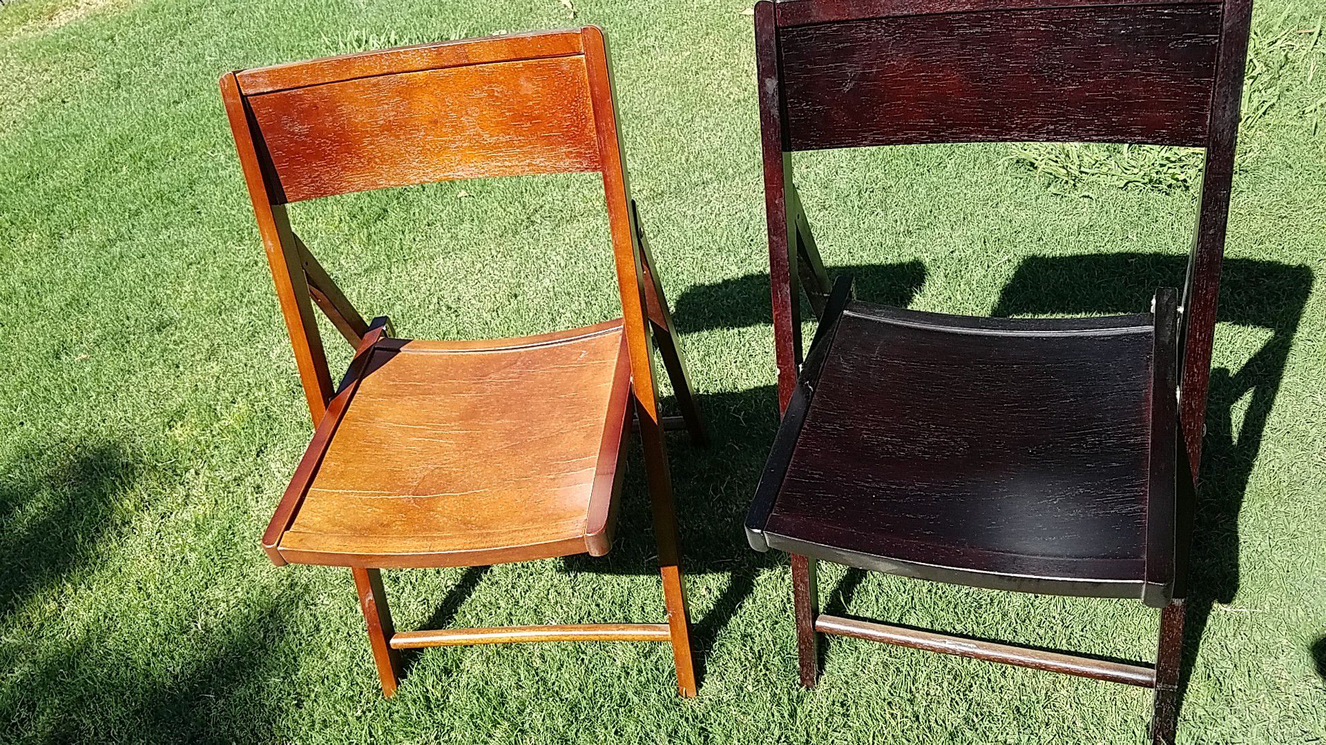 4 black wooden chairs and 4 dark redwood chairs