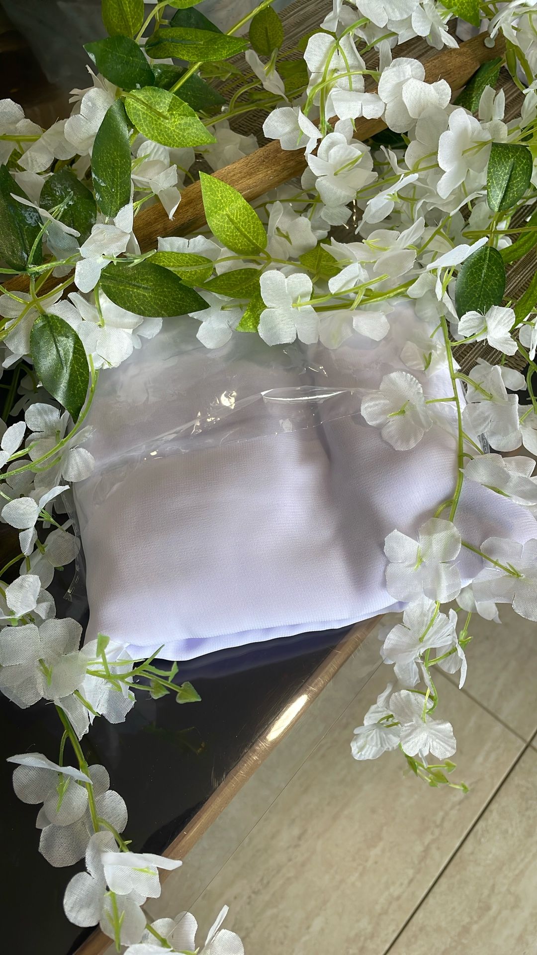 Light lavender arch for Wedding along with white flower vines to go across