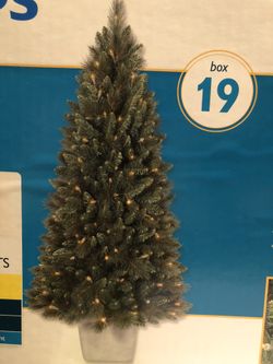 4 foot Balsam Fir Artificial Christmas tree. 100 clear lights. Indoor/outdoor.